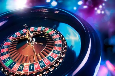Baccarat dealer showing player and banker cards